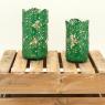 Glass candle holders with green metal leaves design
