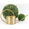 Watering can in golden metal