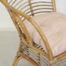 Armchair in coffee brown rattan