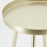 Round golden metal side table 