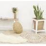 Tapis rond en jute naturelle, motif ethnique teinté.