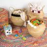 Round natural rush bag with pompoms