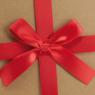Cardboard folding box with ribbon